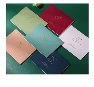 Detailed macro view of various elegant gold foil greeting cards with positive quotes
