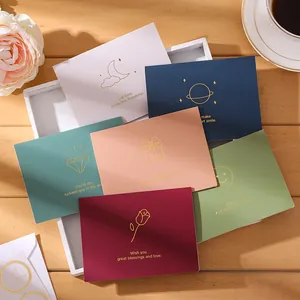 Colorful gold foil greeting cards with English blessings for holiday gift messaging.