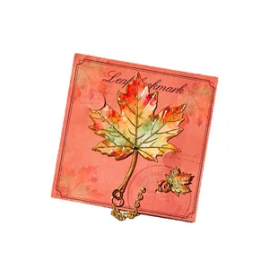 Elegant maple leaf metal bookmark featuring gold chain and vibrant colorful enamel finish