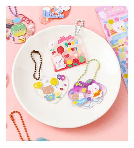 Close-up of cute DIY acrylic charms with colorful cartoon animal stickers for kids