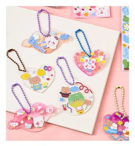 Detailed view of DIY acrylic charms with cute animals and colorful bead chains.