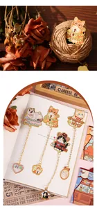 Variety of cute cartoon cat metal bookmarks with delicate gold chains and charms.