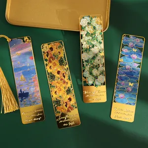 Set of four intricate gold metal bookmarks with Monet and Van Gogh oil painting designs.
