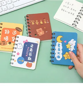 Close-up view of various colorful A7 mini spiral notebooks with cute animal designs
