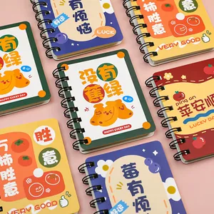 Colorful A7 mini spiral notebooks featuring cute fruit illustrations and positive puns