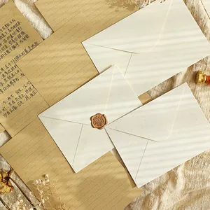 Enveloppes vintage en lin avec autocollants de sceau de cire et ensemble de papier à lettres