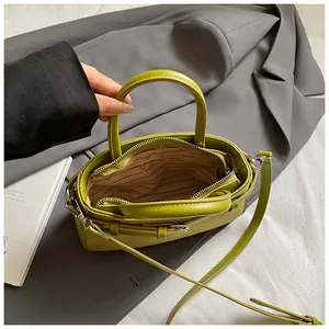 Detailed view of lime green matte vintage crossbody bag showing internal striped lining