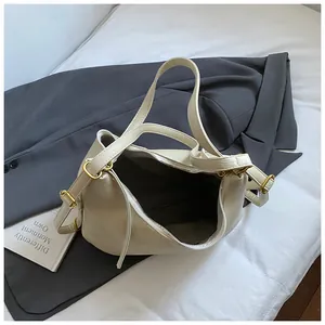Detailed interior view of a large cream white multi-functional commuter tote bag