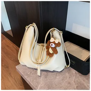 Large cream-white multi-functional tote bag with a cute brown plush bear charm detail