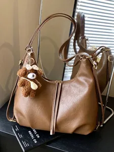 Stylish brown faux leather versatile tote backpack with a cute bear plush charm