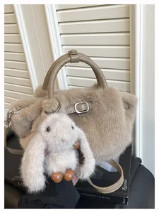 Close-up of khaki plush tote bag with cute bunny charm for autumn/winter