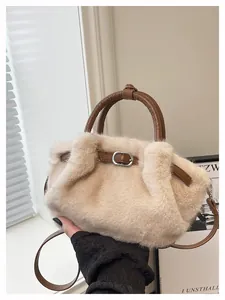 Close-up detail of beige plush faux fur tote bag with brown leather handles