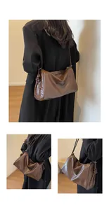 Dettaglio della borsa a tracolla vintage in pelle marrone di grande capacità su modella
