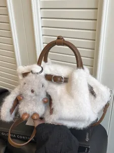White faux fur plush tote bag featuring a cute bunny charm and brown leather straps