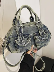 Vintage washed denim Boston bowling bag with front pockets and crossbody strap