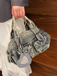 Vintage washed denim bowling bag with heart mirror charm and multiple pockets