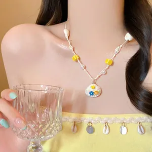 Vibrant dopamine style shell beaded necklace perfect for seaside beach holiday looks