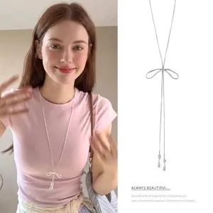 Sweet minimalist silver bow-knot necklace for women with a long adjustable pull-string chain