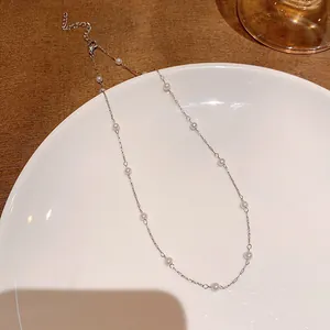 Elegant starry sky style necklace with white pearls on a minimalist silver chain