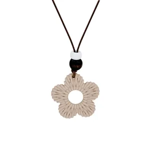 Bohemian minimalist woven flower pendant necklace with wooden beads for beach vacation
