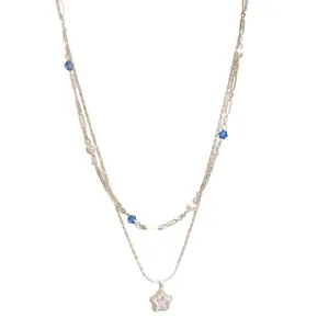 Elegant silver-toned double-layered necklace with zircon star pendant and blue beads