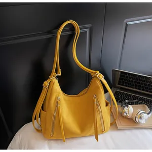 Gele multifunctionele hobo-tas van imitatiesuède voor dames met rugzakriemen