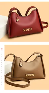 Detailed view of fashionable textured leather shoulder bags in burgundy and khaki colors