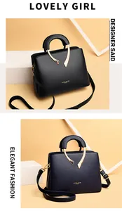 Detailansicht eleganter Handtaschen aus schwarzem und dunkelblauem Narbenleder