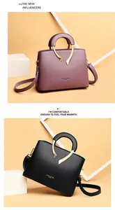 Stilvolle Handtaschen aus Lychee-Leder in Mauve und Schwarz mit V-förmigem Metalldetail
