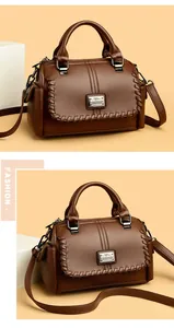 Classic brown textured leather boston bag featuring woven details and adjustable crossbody strap