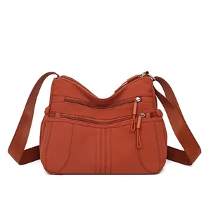 Lightweight multi-pocket crossbody bag for women in burnt orange with large capacity