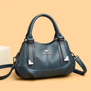 Elegant blue soft leather handbag with three compartments and signature kangaroo logo