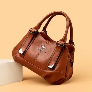 Elegant brown soft leather handbag with triple compartment design and premium texture