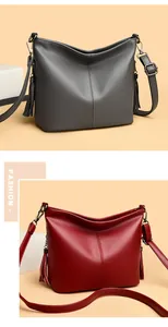 Stylish large capacity textured leather bucket bag with tassels in grey and red colors