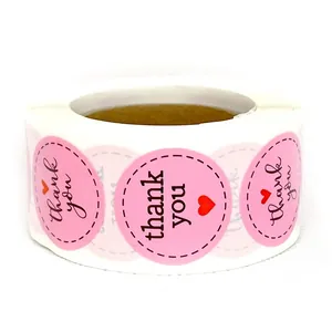 Pink round thank you stickers roll with red heart for wedding and gift packaging