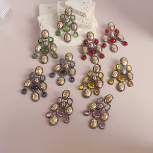 Detailed macro view showing vintage style resin chandelier earrings in various colors