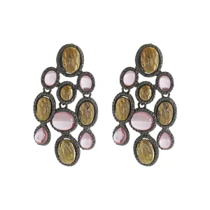 Detailed view of vintage ethnic style colorful resin drop earrings with pink stones