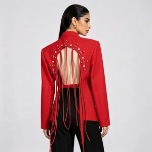 Close-up of stylish red blazer featuring an elegant back cutout and long red fringe