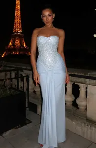 Light blue strapless sequined evening gown with draped ruched skirt details