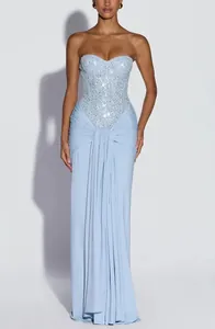 Elegant strapless light blue evening gown with sequined bodice and draped long skirt details.