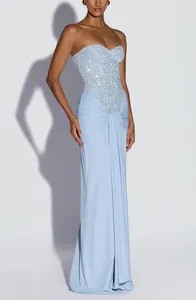 Detail view of light blue evening dress featuring sequined bodice and draped skirt