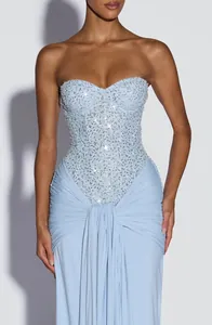 Detailed view of baby blue strapless sequined bodice dress with elegant draping