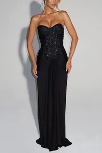 Close-up view of a sexy black sequined strapless slim-fit evening gown for parties.