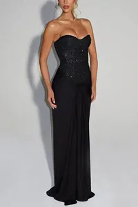 Elegant black strapless evening gown featuring a sequined bodice and draped skirt detail