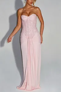 Elegant pink strapless sequin corset evening gown with a draped floor-length skirt.