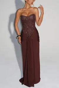 Detailed view of dark brown strapless evening gown with sequined bodice embellishments.