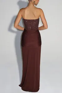 Detailed back view of a strapless floor-length sequin evening dress in deep burgundy