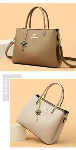 Elegant structured handbags featuring gold-tone hardware and decorative floral charms