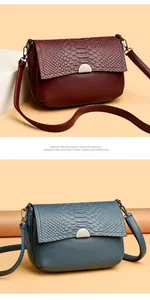 Elegant women's crocodile pattern crossbody bags in wine red and dusty blue leather
