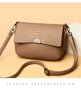 Elegant brown faux leather crossbody bag with crocodile texture flap and metal clasp